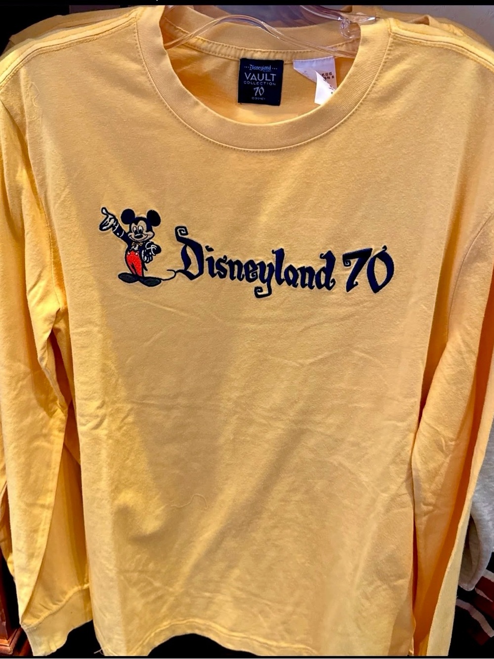 Disney Resort 70th Anniversary Vault Collection Yellow long sleeve shirt.